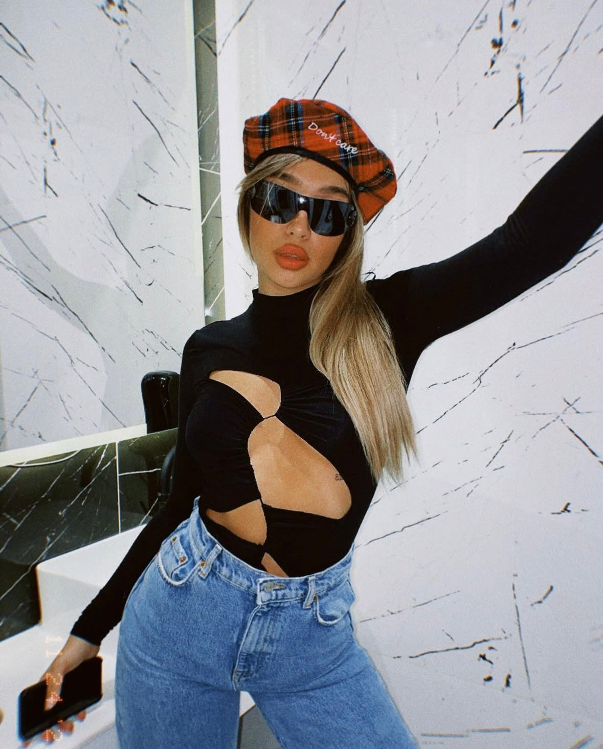 Asymmetrical cut-out top turtleneck