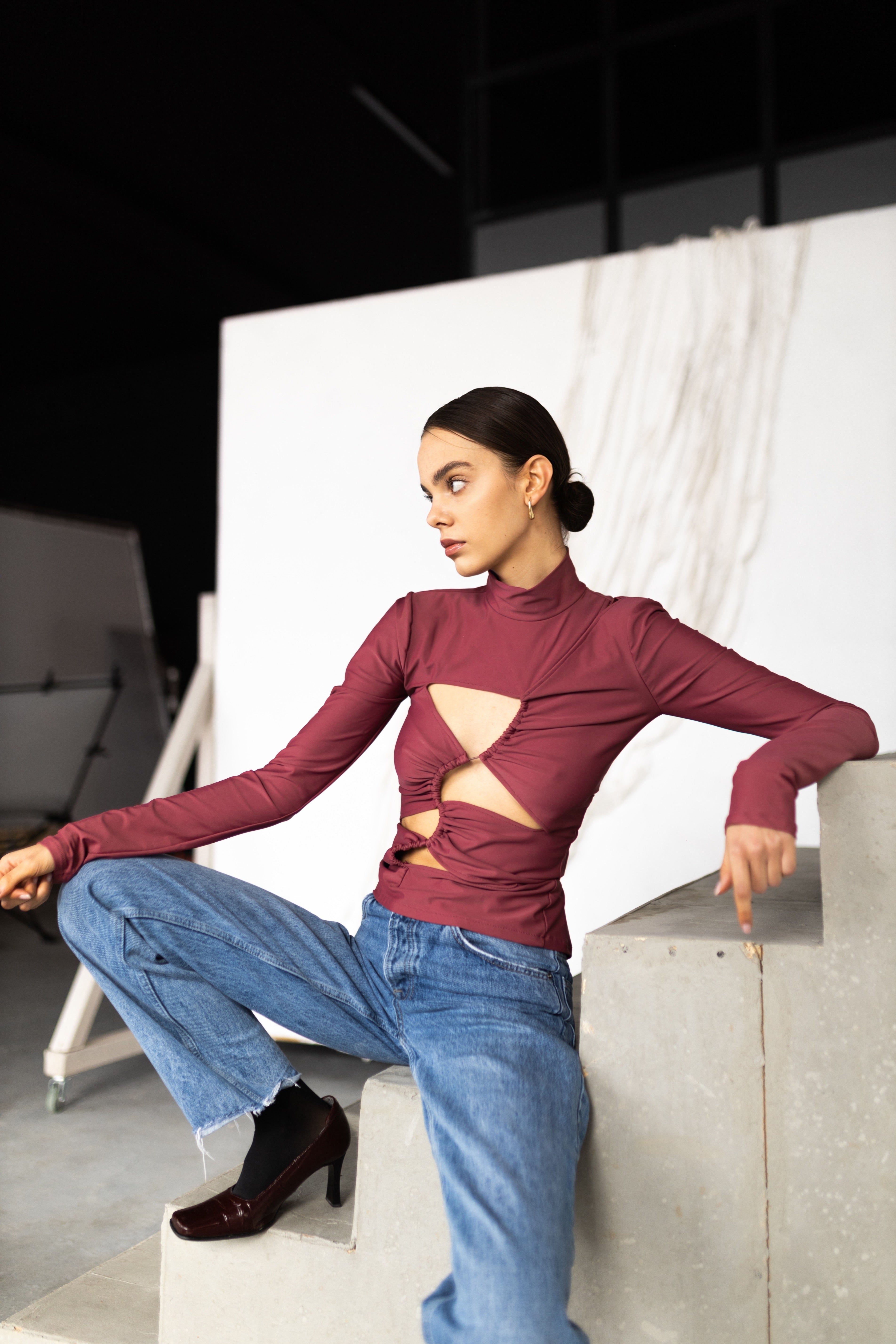 Asymmetrical cut-out top turtleneck